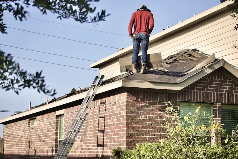 Professional roofer working on a residential roof in Lucky Estates